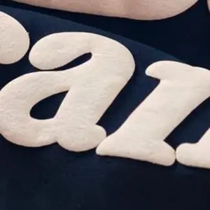 Raised puff screen printing on custom branded apparel